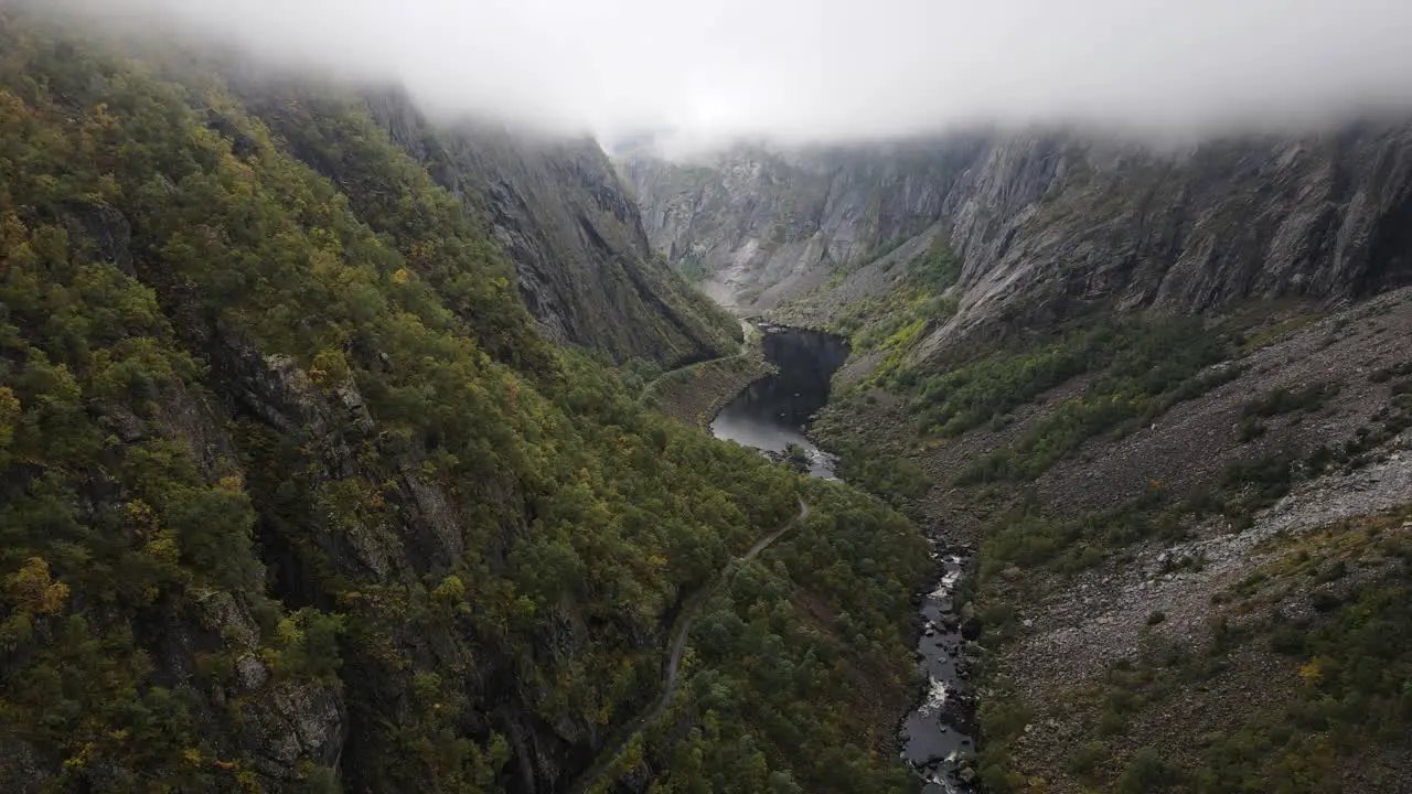 Beautiful view of a valley in Western Norway with low clouds river