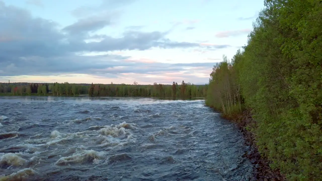 Suspension bridge on Glomma River in the forest in Hedmark county in Norway