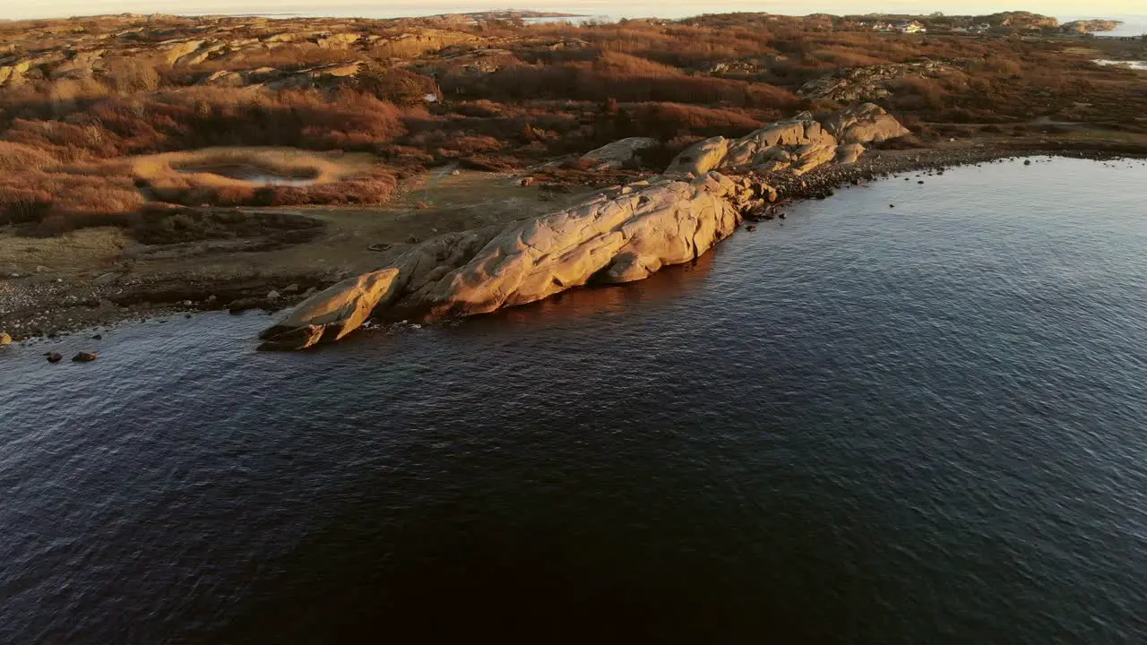 Drone footage of seacoast in Southern Norway at golden hour