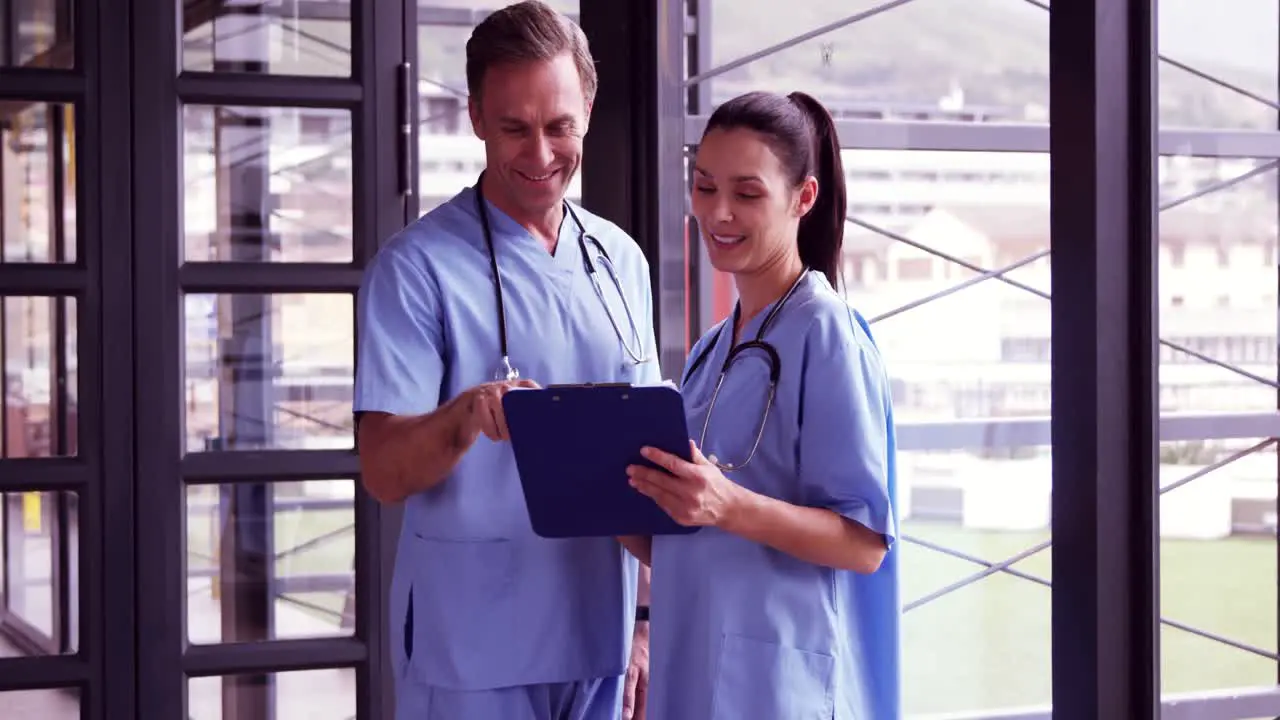 Medical team reading rapport on the clipboard 