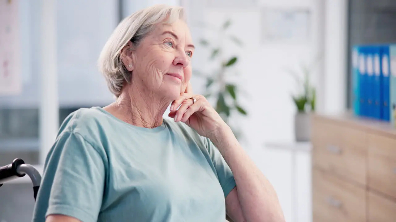 Thinking smile and senior woman in a wheelchair