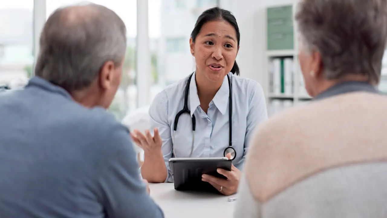 Medical consultation tablet and senior couple