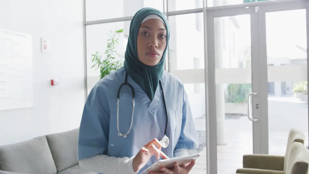 Young female doctor using digital tablet 4k