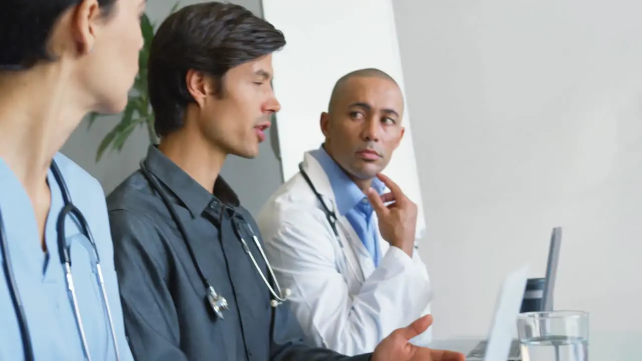 Young doctors sitting at a meeting 4k