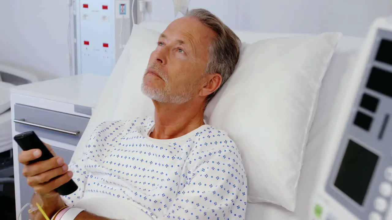 Patient watching television on the bed