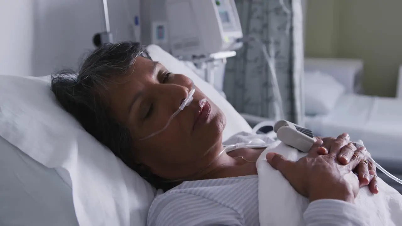 Woman resting in a hospital bed 4k