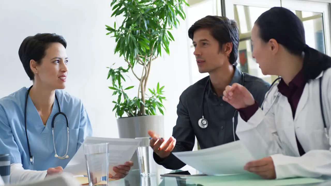 Male doctor talking at meeting with colleagues 4k