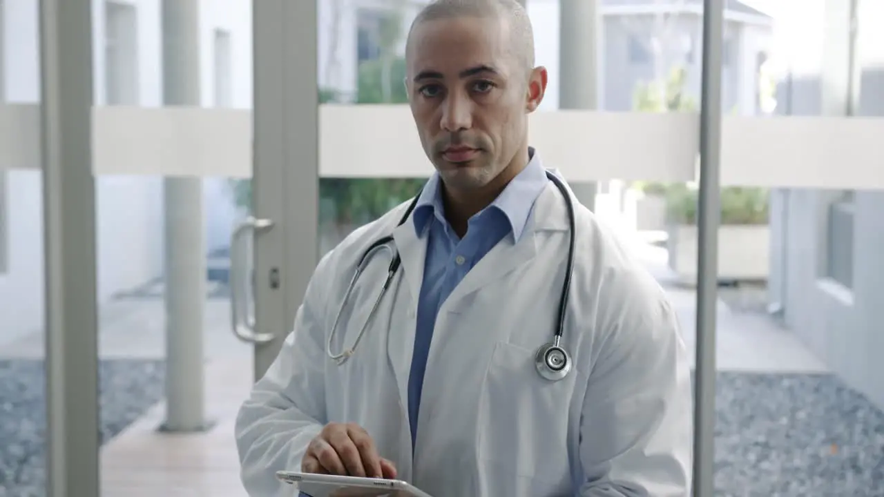 Young male doctor using tablet 4k