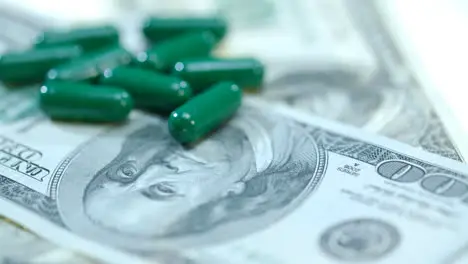 Medical capsule on dollar banknote Herbal capsules on money cash