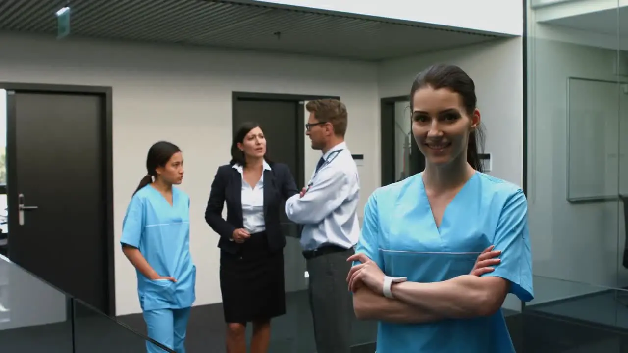 Portrait of female doctor standing with arms crossed in hospital