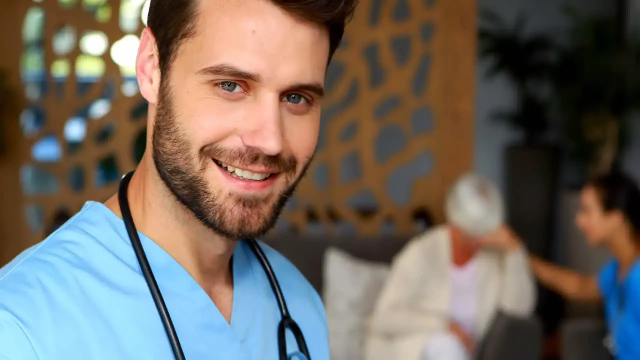 Portrait of male doctor using digital tablet