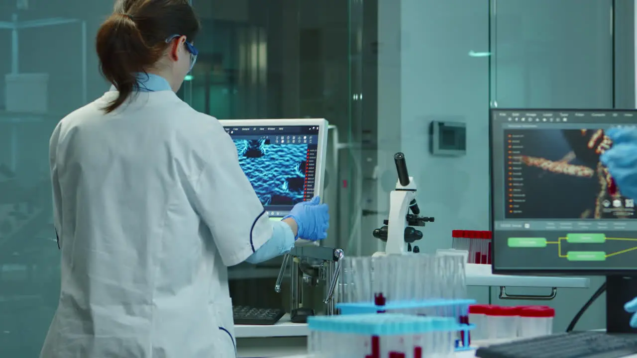 Scientist nurse typing medical reports on computer