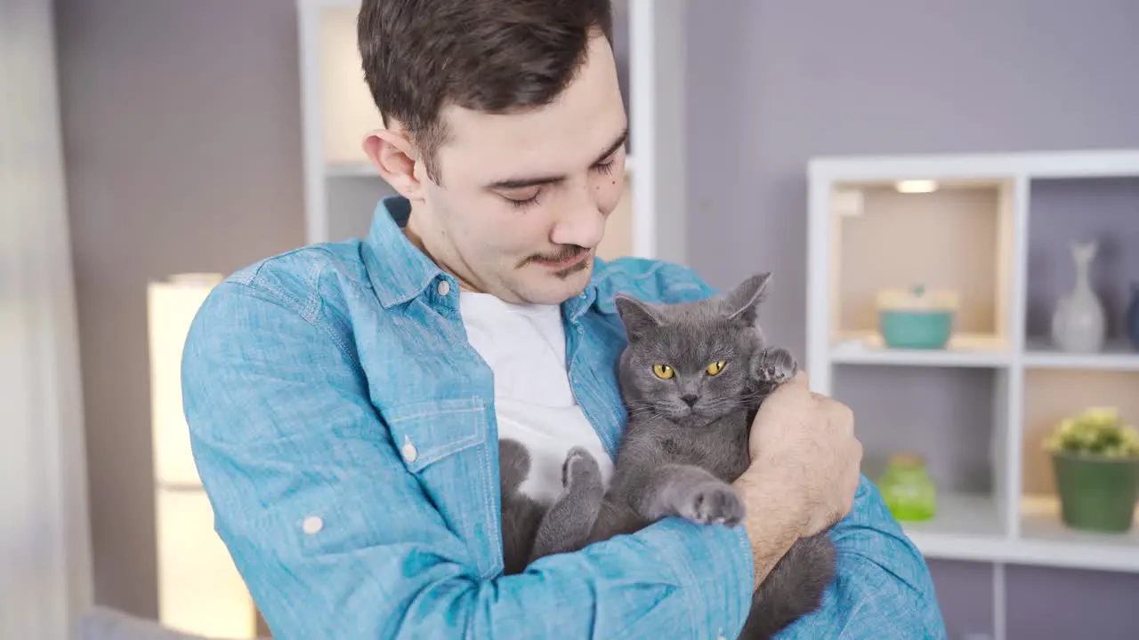 Close-up portrait of happy man and his cat