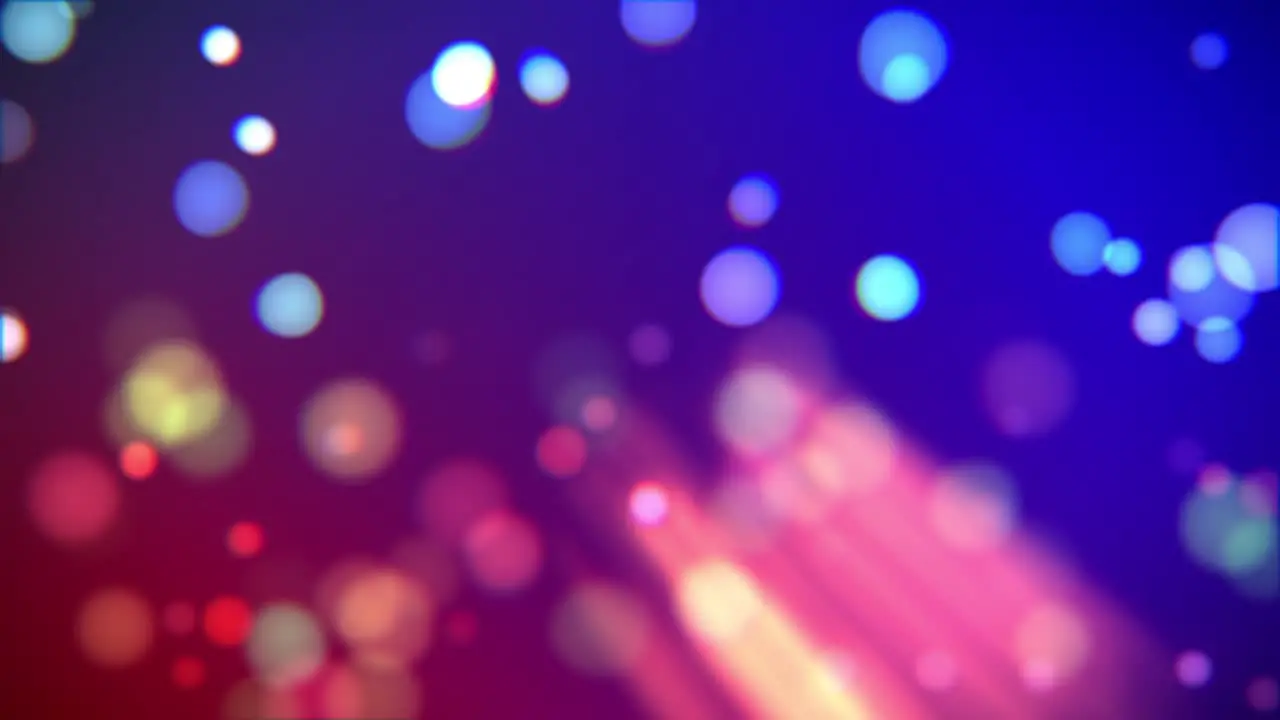 Animation of blue and red bokeh with rays and fluctuating blurred particles