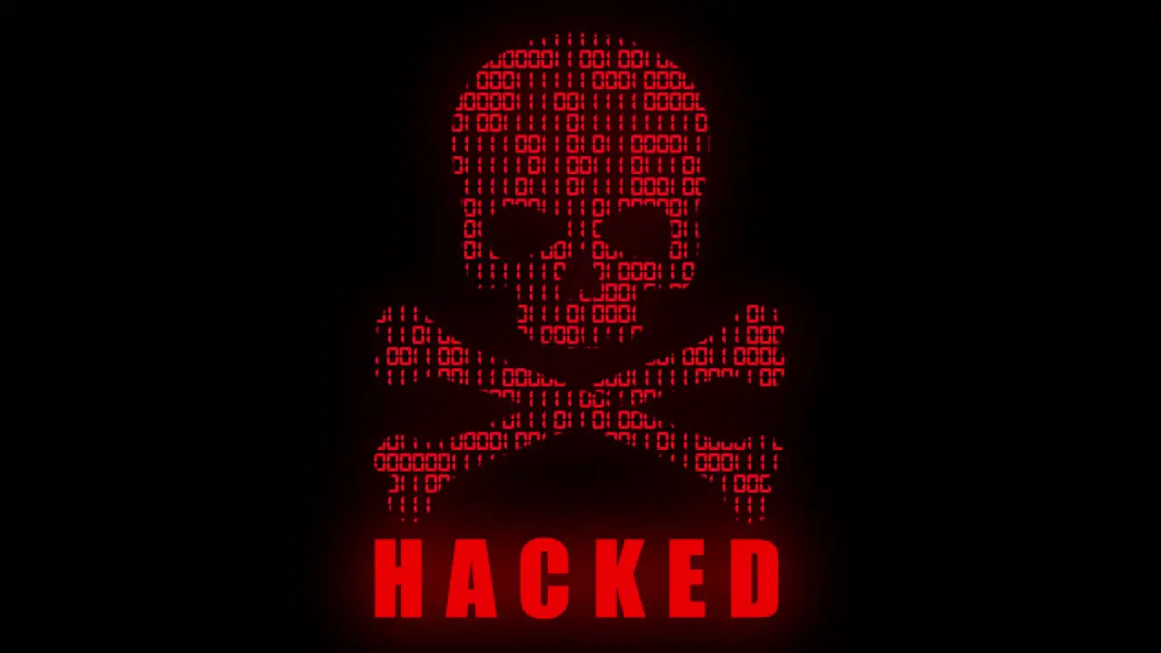 High tech motion graphic with animated binary code theme with red high tech hacker style skull and crossbones motif and flashing Hacked text on a black background