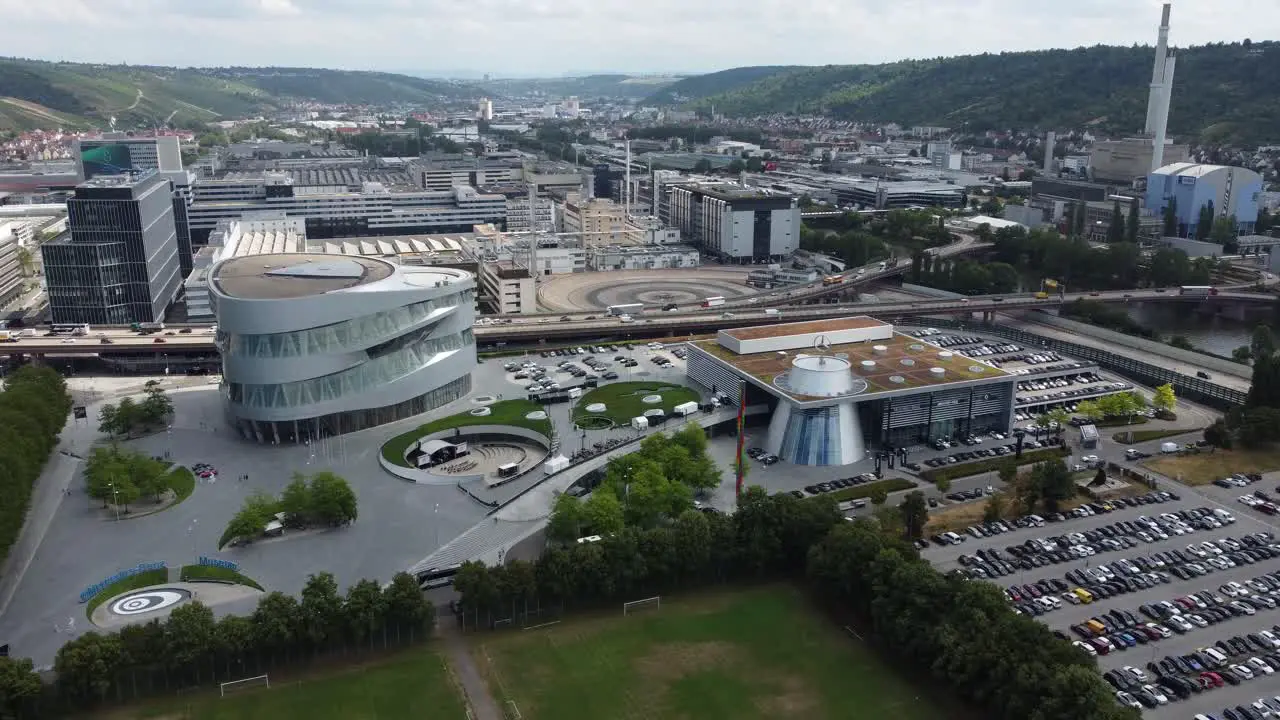 4K Cinematic clip of the urban area and the industrial park of Mercedes Benz museum headquarters test track and Untertürkheim plant in Stuttgart