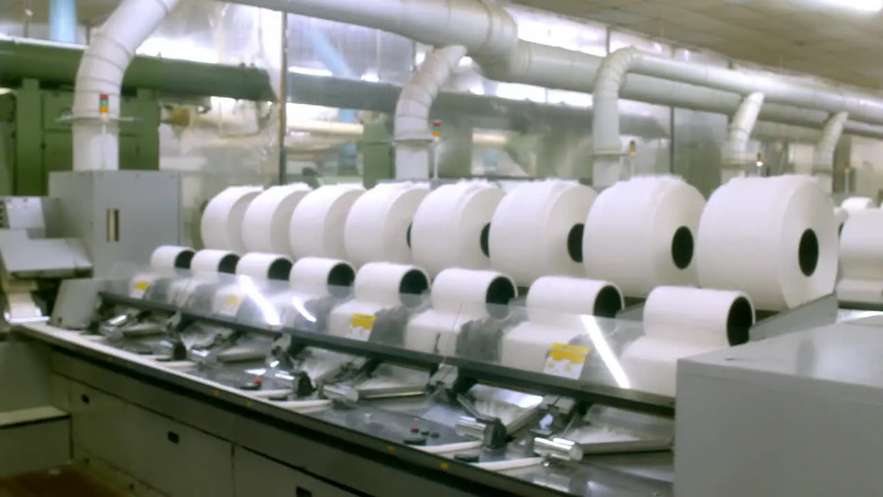 Inside the cotton mill rows of cotton bobbin threads manufacturing process