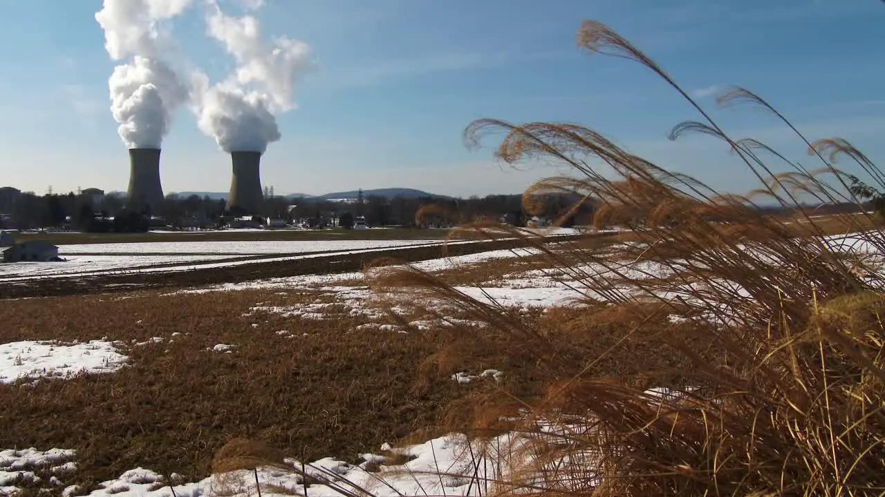 Smoke rises from the nuclear power plant at Three Mile Island Pennsylvania with farm fields foreground