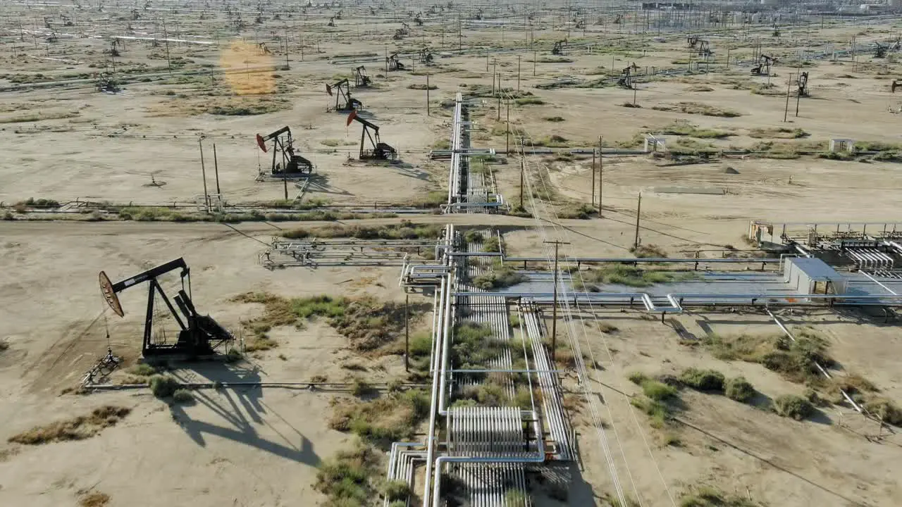 Aerial of pumpjacks in a fracking field drilling for oil concept of climate crisis