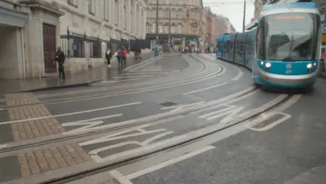 Tram In Birmingham UK City Centre On Rainy Day