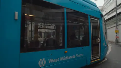 Tram In Birmingham UK City Centre On Rainy Day 1