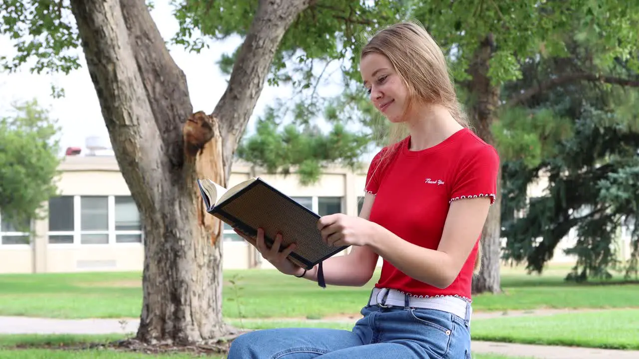 A college student contemplates the meaning of what she has just read