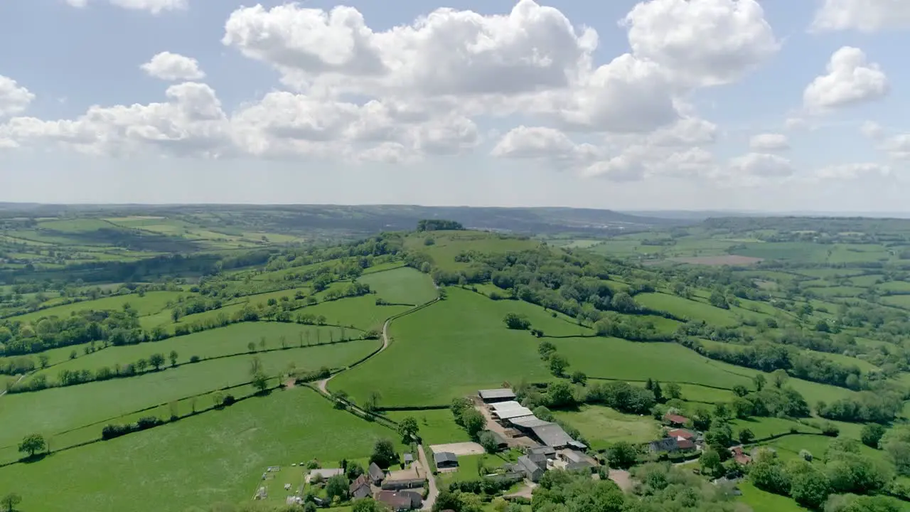 Picturesque aerial of solitary countryside hill in the rolling Devon landscape