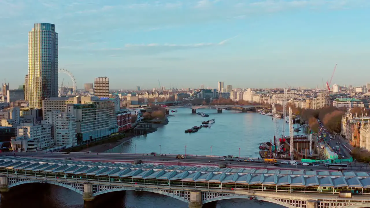 Cinematic aerial drone shot of blackfriars bridge towards London Eye and Houes of parliment London