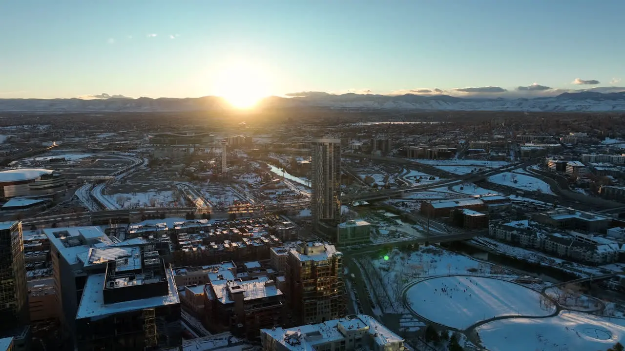 Aerial drone shot of sunset moving around over Commons Park Denver