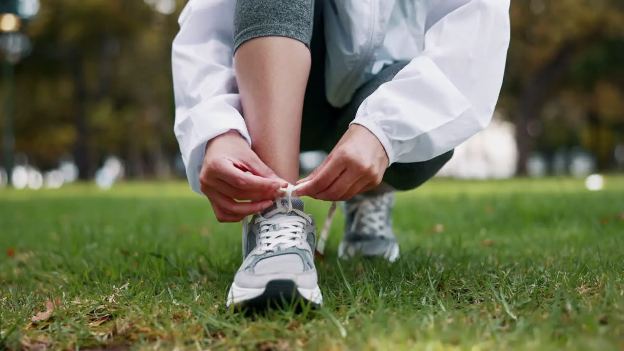 Fitness hands and woman tie shoes lace before