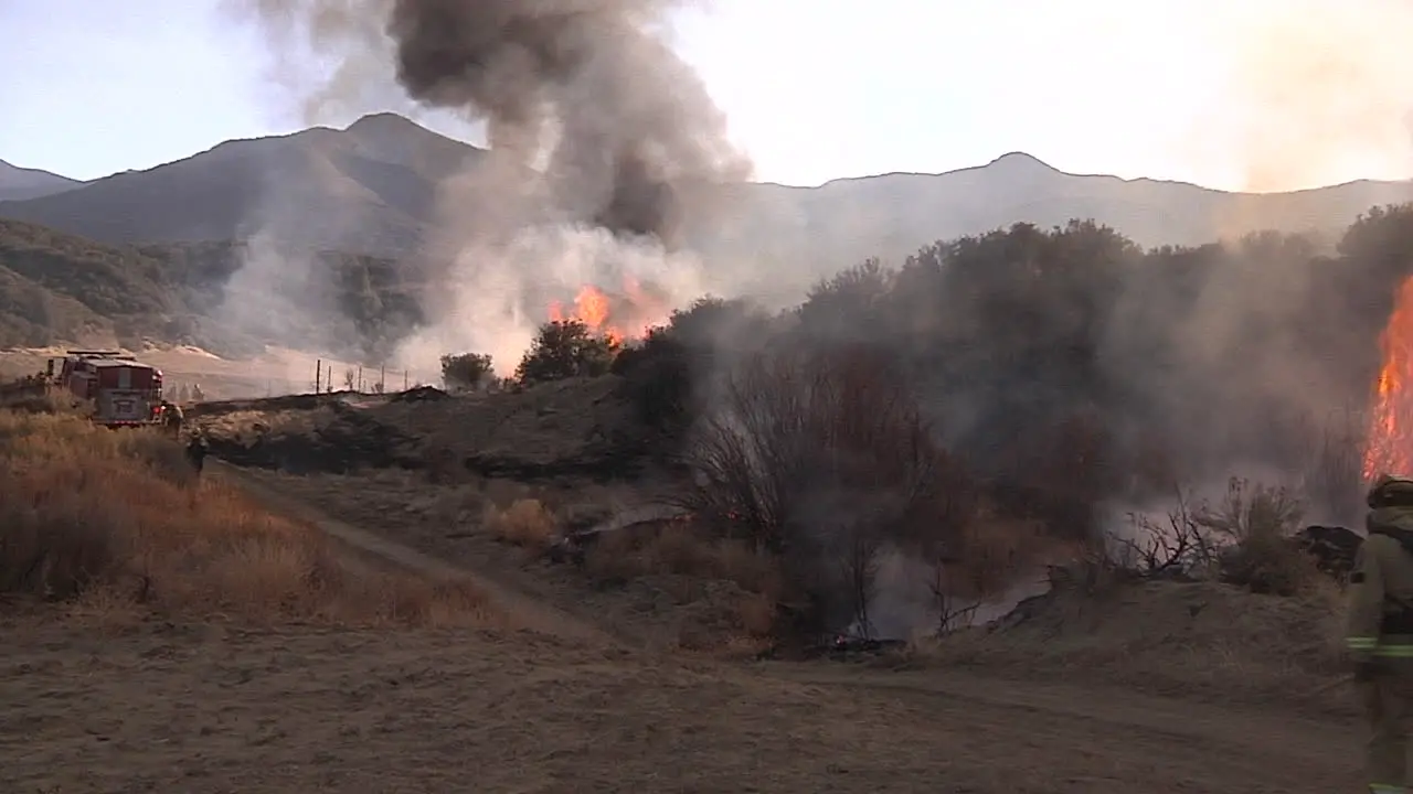 Firefighters Look On As A Blaze Burns Out Of Control In California 4