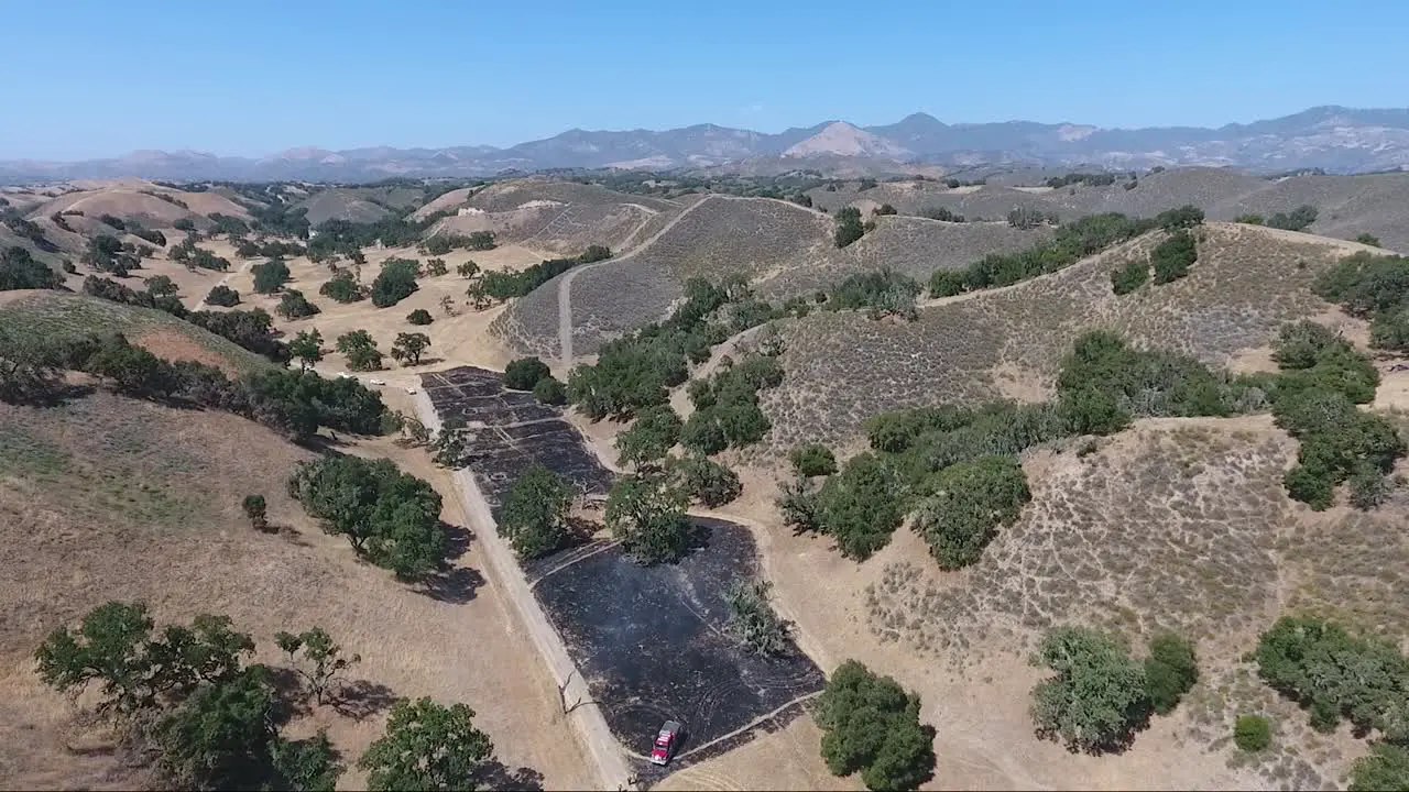 Firefighter Trainee's burn grassland below ridge