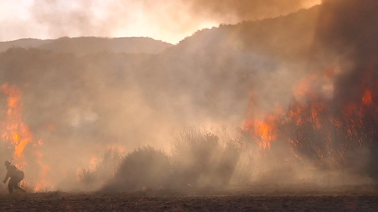 Firefighters Look On As A Blaze Burns Out Of Control In California 3