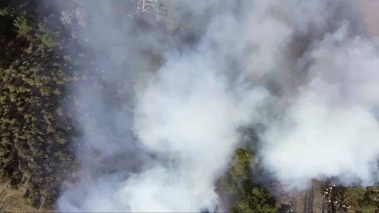 AERIAL Smoke towers over the flames of a wildfire