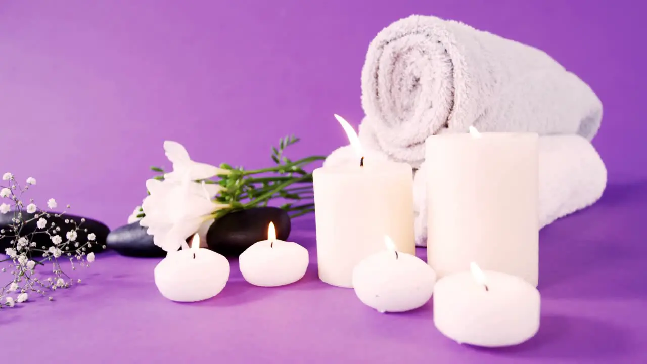 Pebbles candle towel and flowers