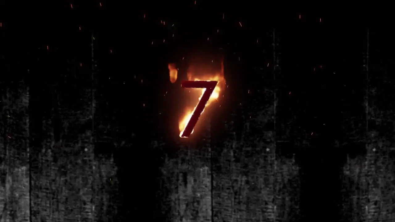 Animation of 7 text in burning flames over dark background