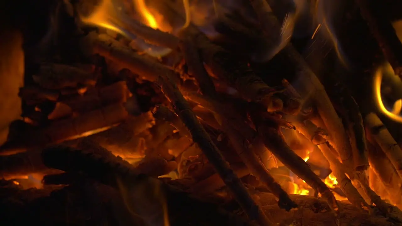 Wooden Sticks on Fire and Ash in the Fireplace