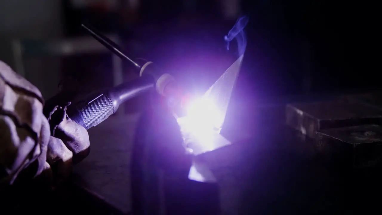 Welder welding a metal