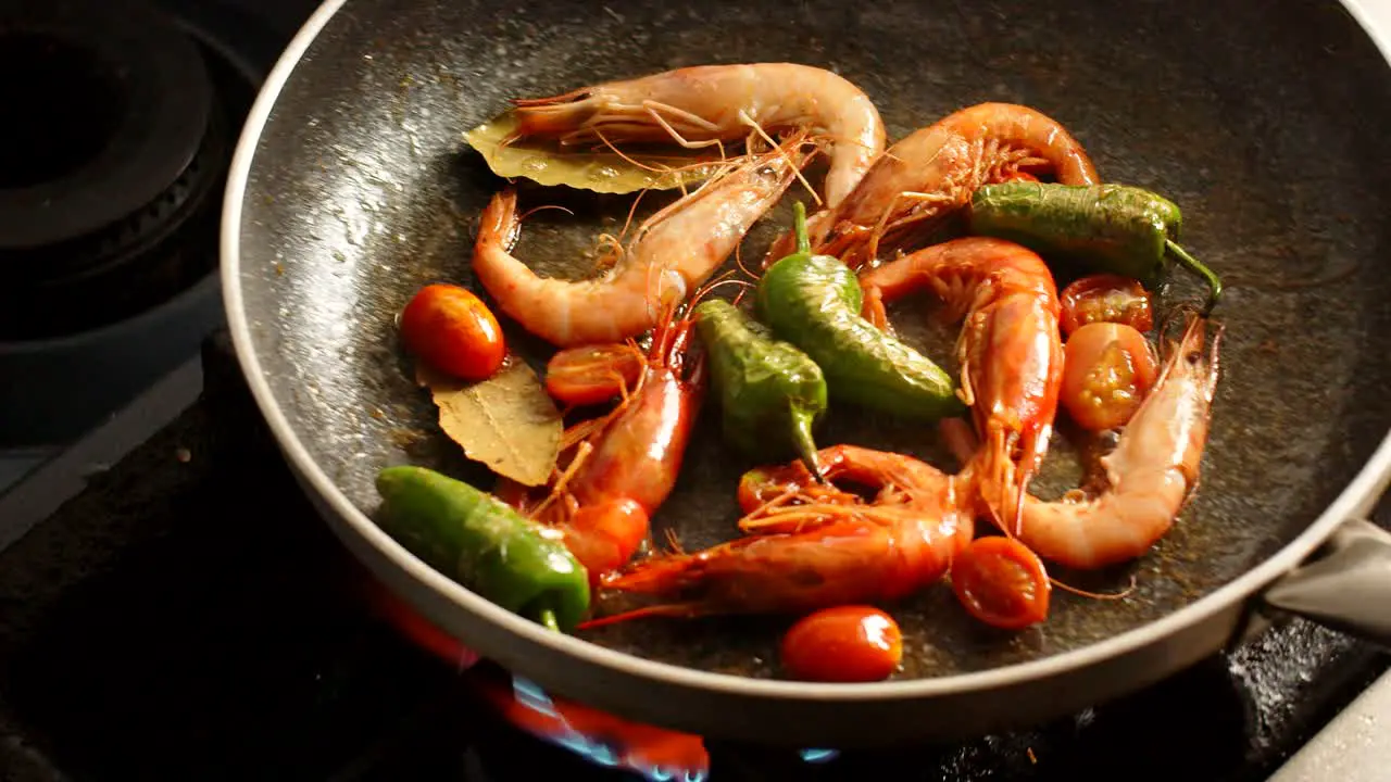 Cooking shrimps in frying pan