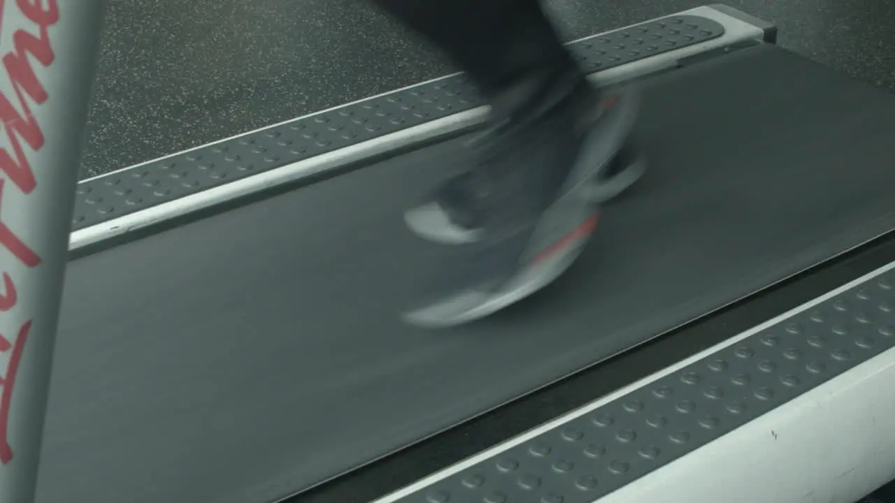 Close Up of a Man's Feet Running on a Treadmill