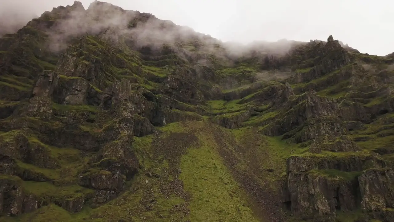 An aerial of a lush mountain on a moody day in iceland