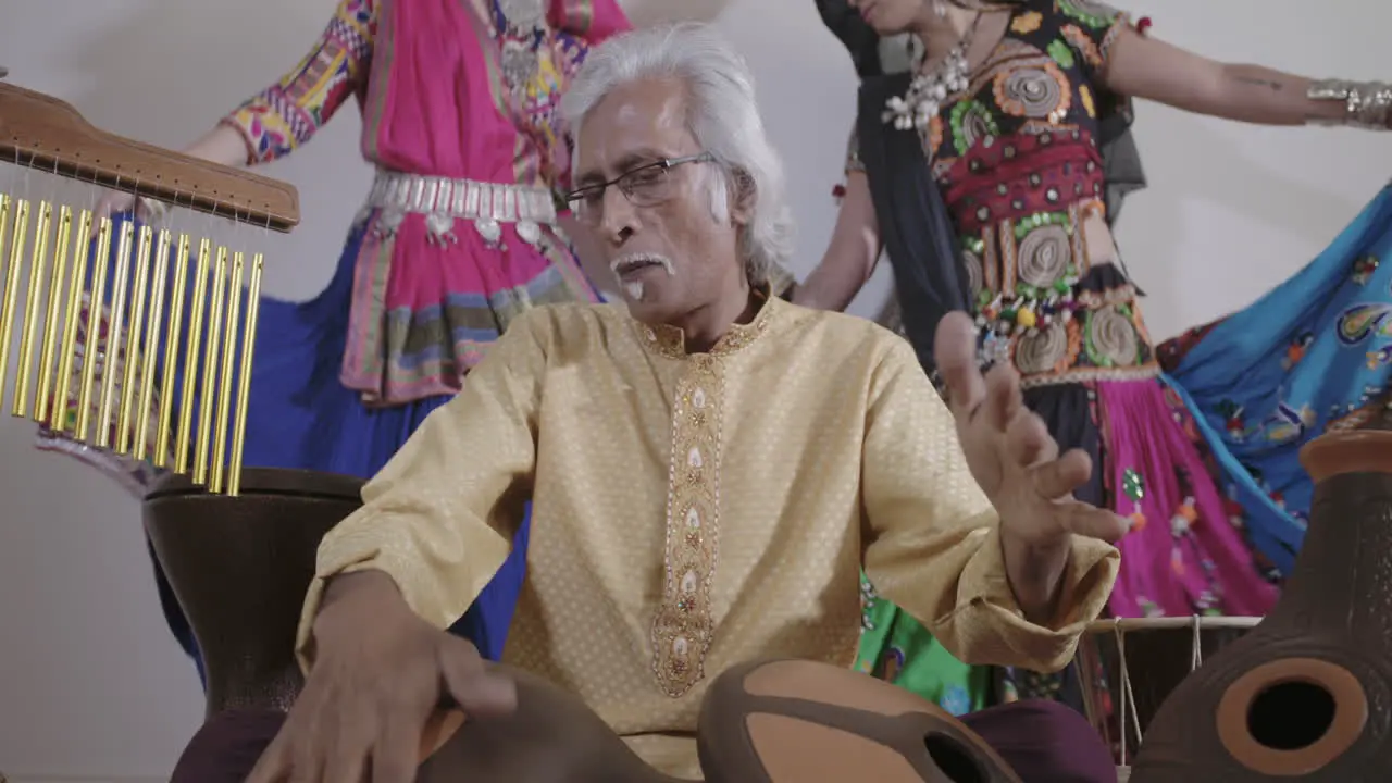 Indian Percussion Musician with Dancers 06