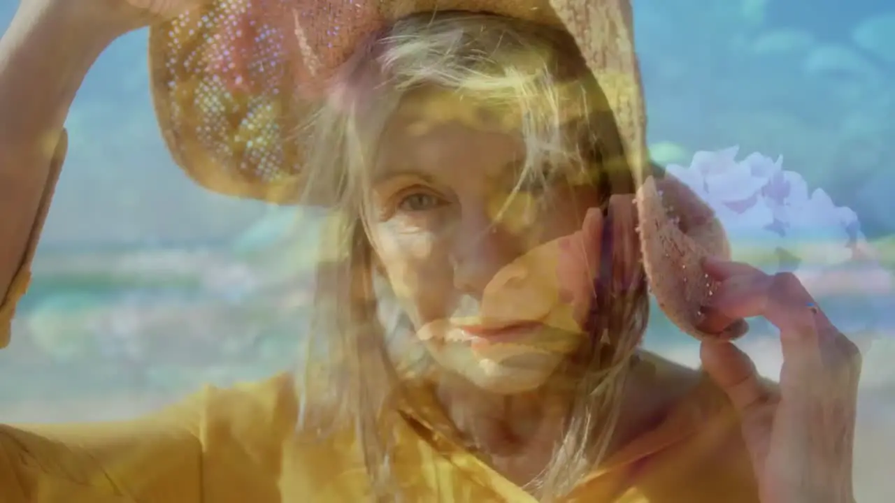 Composite video of caucasian senior woman wearing a hat smiling against flower in the garden