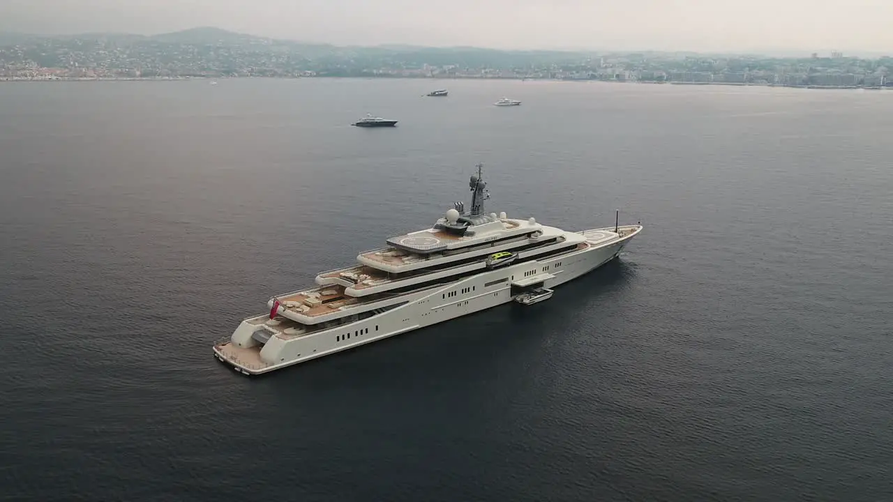 Aerial orbit around large luxury cruise ship at sea