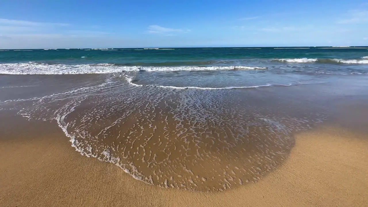 waves rolling into shore leaving beautiful patterns in the sea-foam