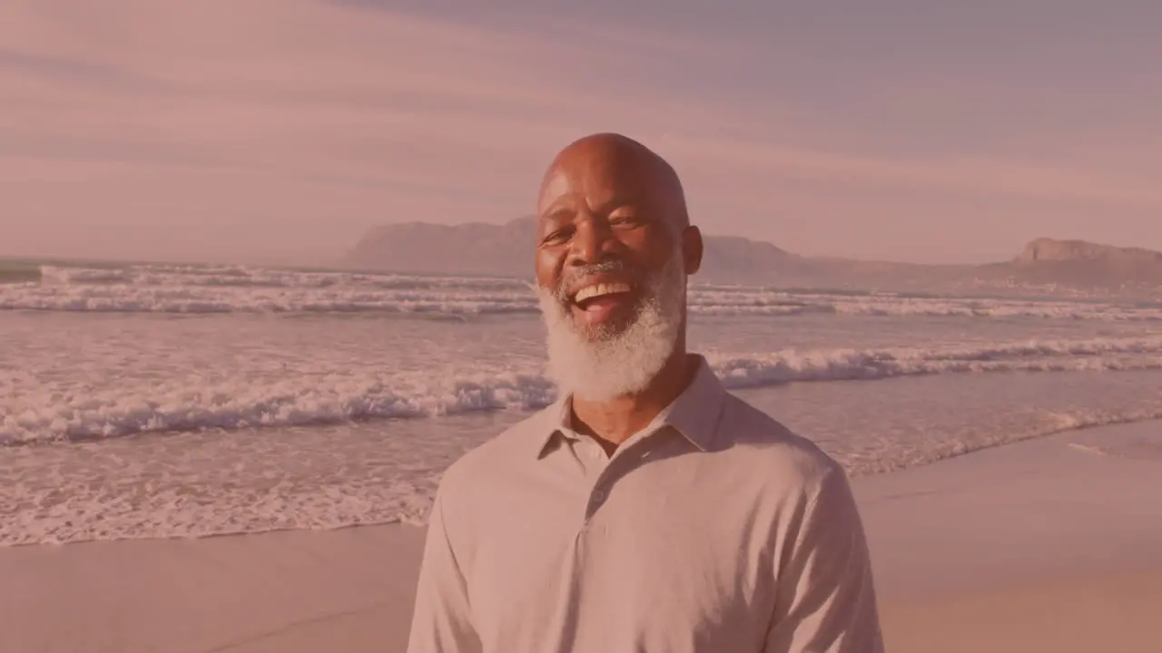 Portrait of african american senior man smiling at the beach