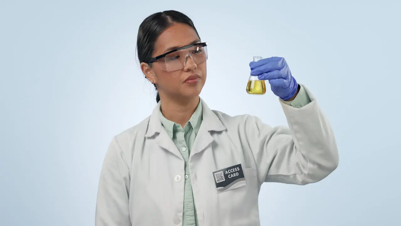 Studio woman or scientist with solution in glass