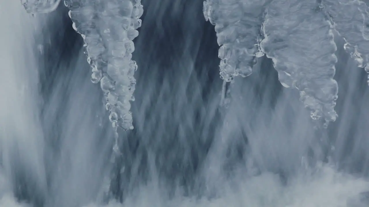 Nature background Small waterfall in winter Water flowing in winter