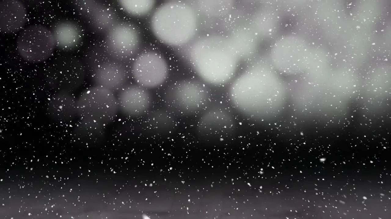 Video composition with falling snow over reveal of star trail