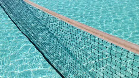 Water surface texture Slow motion clean swimming pool ripples and wave Refraction of sunlight top view texture sea side white sand sun shine water background Water Caustic Background